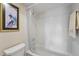 Cozy bathroom featuring a shower-tub combination and neutral-colored tile at 204 Quayside Cir # 501, Maitland, FL 32751