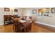 Dining area with wood table, seating for four, hardwood floors, and adjacent pass through to the kitchen at 204 Quayside Cir # 501, Maitland, FL 32751