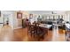 Open dining room flowing into a comfortable living space with hardwood flooring at 204 Quayside Cir # 501, Maitland, FL 32751
