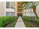Inviting condo entrance with lush landscaping and a serene walkway at 204 Quayside Cir # 501, Maitland, FL 32751