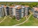 Beautiful condo buildings with screened balconies, well-maintained landscaping, and a serene walkway at 204 Quayside Cir # 501, Maitland, FL 32751