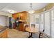 Kitchen features stainless appliances, granite counters, breakfast nook with white shutters, and tile flooring at 204 Quayside Cir # 501, Maitland, FL 32751