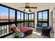 Enjoy the glass-enclosed lanai with beautiful water views, comfortable seating, and plenty of natural light at 204 Quayside Cir # 501, Maitland, FL 32751