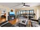Inviting living room featuring a fireplace, hardwood floors and a sliding door to the lanai at 204 Quayside Cir # 501, Maitland, FL 32751