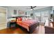 Comfortable bedroom with ceiling fan, light blue walls, and a large window with view of the outdoors at 204 Quayside Cir # 501, Maitland, FL 32751