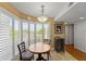 Breakfast nook features a bay window with wood shutters, a cozy table with seating for four at 204 Quayside Cir # 501, Maitland, FL 32751