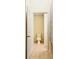 Compact half bathroom showcasing a standard toilet and tiled floors, located conveniently off the hallway at 2144 Rookery Ln, Sanford, FL 32773