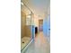Bathroom featuring a walk-in shower with glass doors and tile flooring at 2144 Rookery Ln, Sanford, FL 32773