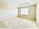 Bright bedroom featuring a tray ceiling and a window that provides natural light at 2144 Rookery Ln, Sanford, FL 32773