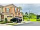 Two-story home with a one-car garage, shutters, and manicured landscaping at 2144 Rookery Ln, Sanford, FL 32773