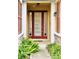 Inviting front entrance with decorative glass door and lush landscaping at 2144 Rookery Ln, Sanford, FL 32773