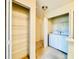 Laundry room with a washer, dryer, and storage shelving at 2144 Rookery Ln, Sanford, FL 32773