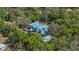 Aerial view of a secluded home surrounded by lush trees and greenery at 2240 W Dale Cir, Deland, FL 32720