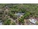 Expansive aerial view of a private estate nestled among lush, mature trees and beautiful landscaping at 2240 W Dale Cir, Deland, FL 32720