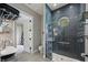 Modern bathroom with a unique circular window in the blue tiled shower at 2240 W Dale Cir, Deland, FL 32720