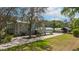 Charming home with a manicured lawn, showcasing the meticulously designed paver driveway and picturesque landscaping at 2240 W Dale Cir, Deland, FL 32720