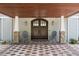 Inviting front entrance featuring a covered porch with stone accents and charming chairs at 2240 W Dale Cir, Deland, FL 32720