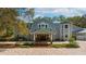 Attractive front entrance of a home with a paver driveway, inviting porch, and well-maintained landscaping at 2240 W Dale Cir, Deland, FL 32720
