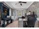 Well-appointed home office with built-in shelving, large desk, and bay windows offering ample natural light at 2240 W Dale Cir, Deland, FL 32720