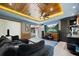 Cozy living room with custom wood ceiling, large screen, opening up to the pool area at 2240 W Dale Cir, Deland, FL 32720