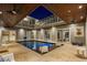 Beautiful indoor pool with seating, wood plank ceilings, and direct access to the home at 2240 W Dale Cir, Deland, FL 32720
