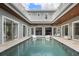 Beautiful courtyard pool surrounded by the house with plenty of seating and natural light at 2240 W Dale Cir, Deland, FL 32720