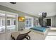 Indoor recreation area with hot tub, lounge chairs, and a spiral staircase at 2240 W Dale Cir, Deland, FL 32720
