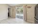 Bright kitchen area with large glass sliding doors offering views of the pool at 2662 Haulover Blvd, Deltona, FL 32738
