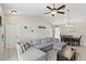 Cozy living room with vaulted ceilings, tile flooring, and an open layout to the dining area at 2662 Haulover Blvd, Deltona, FL 32738