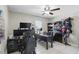 Comfortable office space with tile floors, a ceiling fan, and a built-in bookcase at 2662 Haulover Blvd, Deltona, FL 32738