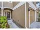 Close up of the home's entry, with a pathway leading to the front door and garage at 2804 Polvadero Ln # 107, Orlando, FL 32835