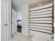 Main bathroom shows the tub-shower combo with a peek into the bedroom, plus white cabinets at 2804 Polvadero Ln # 107, Orlando, FL 32835