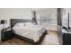 Main bedroom features wood-look flooring, three windows, and modern furnishings and decor at 2804 Polvadero Ln # 107, Orlando, FL 32835