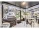Enclosed patio featuring a barbecue grill, outdoor seating, and screen enclosure at 2804 Polvadero Ln # 107, Orlando, FL 32835