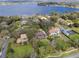 Aerial view of house with lake view and inground swimming pool at 2931 Sunbittern Ct, Windermere, FL 34786