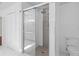 Bright bathroom featuring a glass-enclosed shower with modern fixtures and stylish tile work at 2931 Sunbittern Ct, Windermere, FL 34786