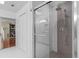 Modern bathroom features a glass enclosed shower with gray tiling at 2931 Sunbittern Ct, Windermere, FL 34786