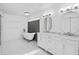 Elegant bathroom featuring a clawfoot tub, marble countertops and double sinks at 2931 Sunbittern Ct, Windermere, FL 34786
