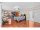Spacious bedroom features a ceiling fan and wood floors at 2931 Sunbittern Ct, Windermere, FL 34786