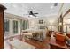 Spacious bedroom featuring a decorative ceiling, wood floors, french doors and a comfortable seating area at 2931 Sunbittern Ct, Windermere, FL 34786