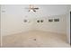 Bright bedroom featuring tile floors, neutral walls, and natural light from multiple windows at 2931 Sunbittern Ct, Windermere, FL 34786