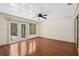 Spacious bedroom with decorative ceilings, hardwood floors, fan, and natural light at 2931 Sunbittern Ct, Windermere, FL 34786