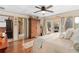 Charming bedroom with wood floors, a decorative ceiling, and access to a private outdoor patio at 2931 Sunbittern Ct, Windermere, FL 34786