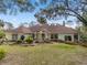 Beautiful single-story home with a well-manicured lawn, mature trees and a serene outdoor setting at 2931 Sunbittern Ct, Windermere, FL 34786