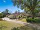 Beautiful home showcasing manicured landscaping and a charming facade, creating a welcoming curb appeal at 2931 Sunbittern Ct, Windermere, FL 34786