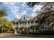 Stately building with a charming front facade, balconies, and manicured landscaping at 2931 Sunbittern Ct, Windermere, FL 34786