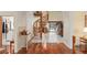 Bright foyer featuring a spiral staircase, hardwood floors, and views of the pool at 2931 Sunbittern Ct, Windermere, FL 34786
