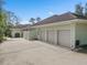 Spacious three-car garage with ample parking space and exterior access to the side yard at 2931 Sunbittern Ct, Windermere, FL 34786