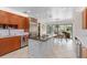 Spacious kitchen with custom island, stainless appliances, and a view of the outdoor pool at 2931 Sunbittern Ct, Windermere, FL 34786