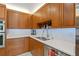 A modern kitchen boasts sleek countertops, ample cabinet space, stainless steel appliances, and subway tile backsplash at 2931 Sunbittern Ct, Windermere, FL 34786